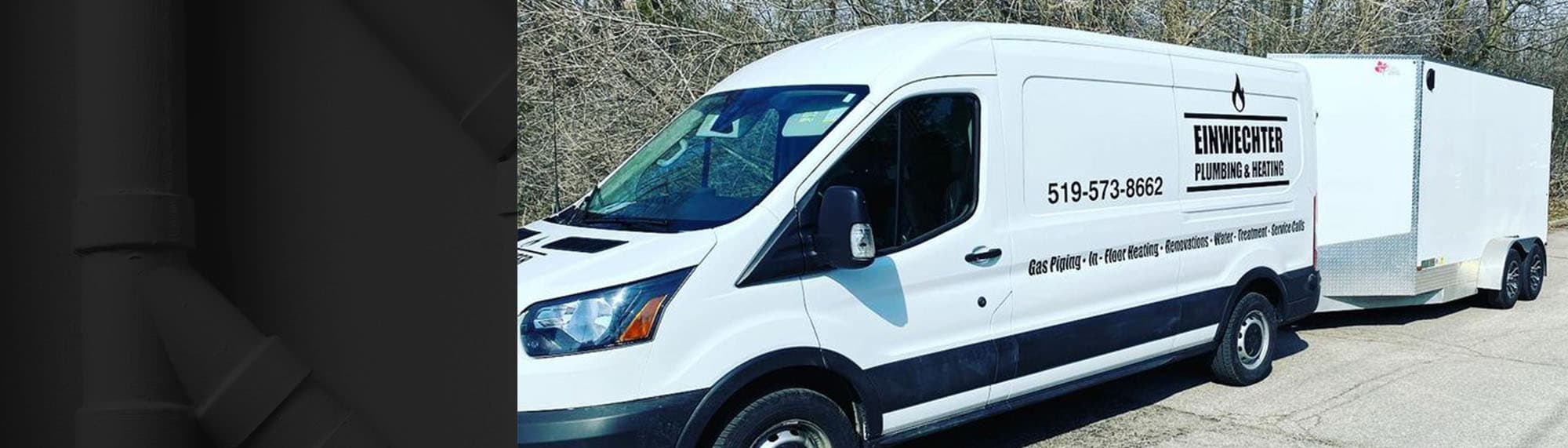 White Einwechter Plumbing service van with utility trailer at a job site